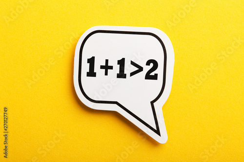 Synergy 1+1>2 Speech Bubble Isolated On Yellow Background