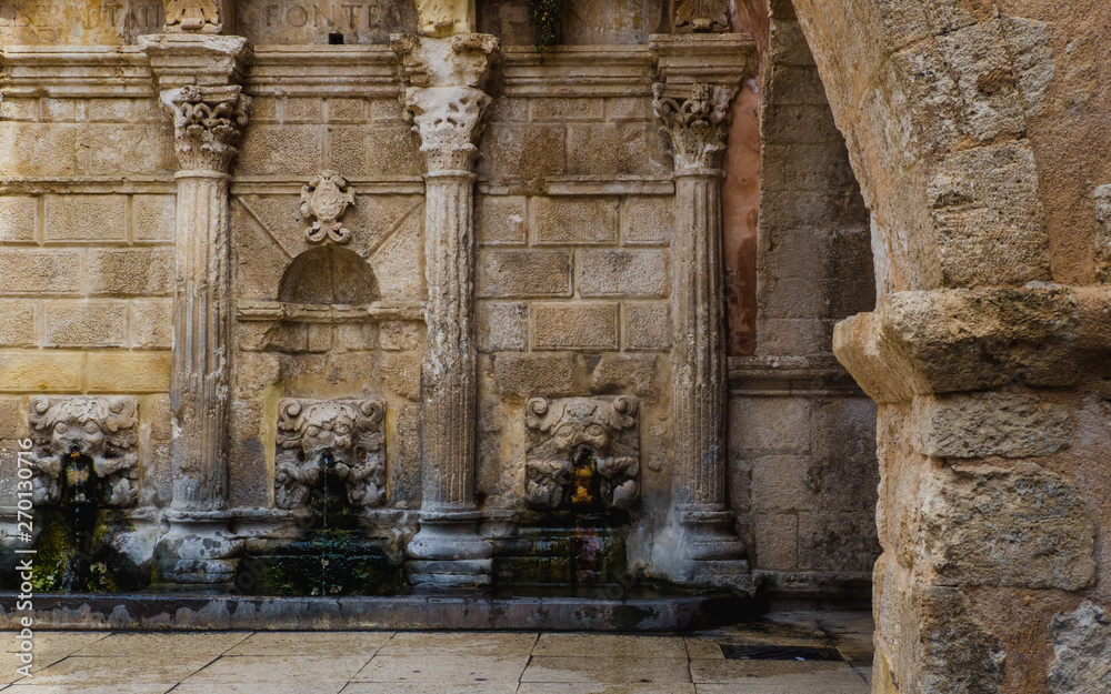 Fototapeta premium Ancient Roman fountain in Rethymnon Old Town - Crete, Greece