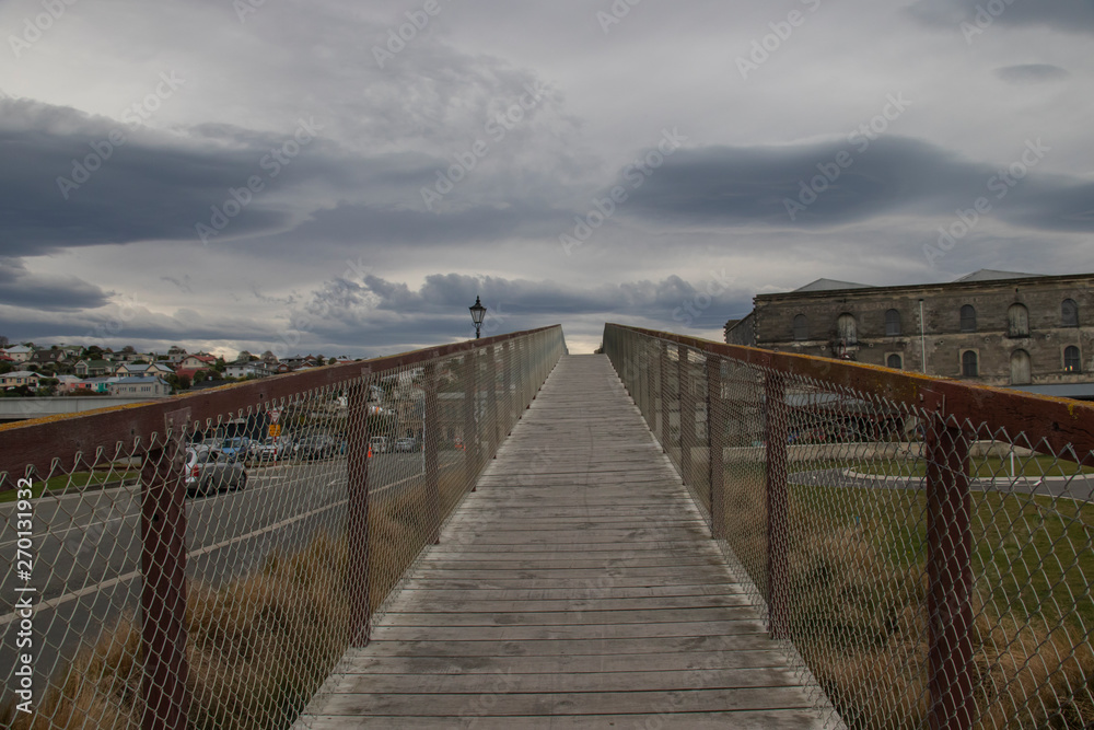 footbridge vanishing point and clouds in Friendly Bay in Oamaru in New Zealand. footbridge vanishing point and clouds in Friendly Bay in Oamaru in New Zealand.