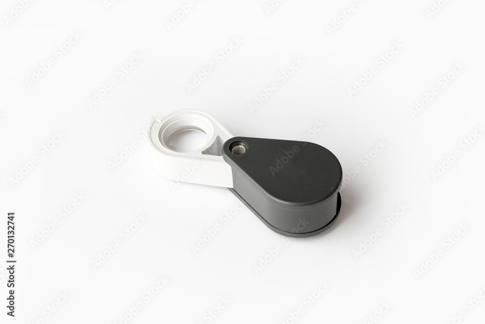 Magnifying glass for diamonds or see the amulet Isolated on a White Background. Magnifying glass for diamonds or see the amulet Isolated on a White Background.