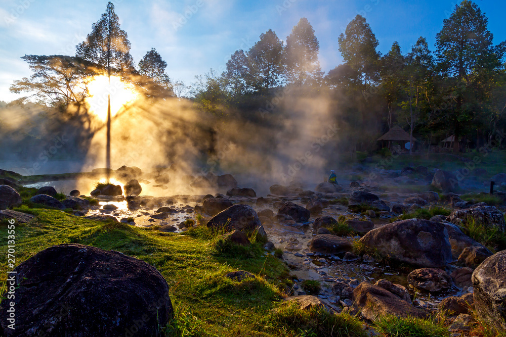 Hot springs beautiful with sunrise and fog Hot springs beautiful with sunrise and fog