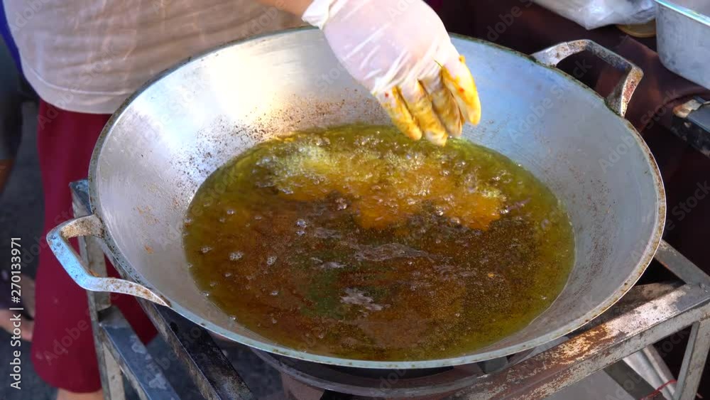 Deep fried fish pasty in hot a frying in hot pan Deep fried fish pasty in hot a frying in hot pan