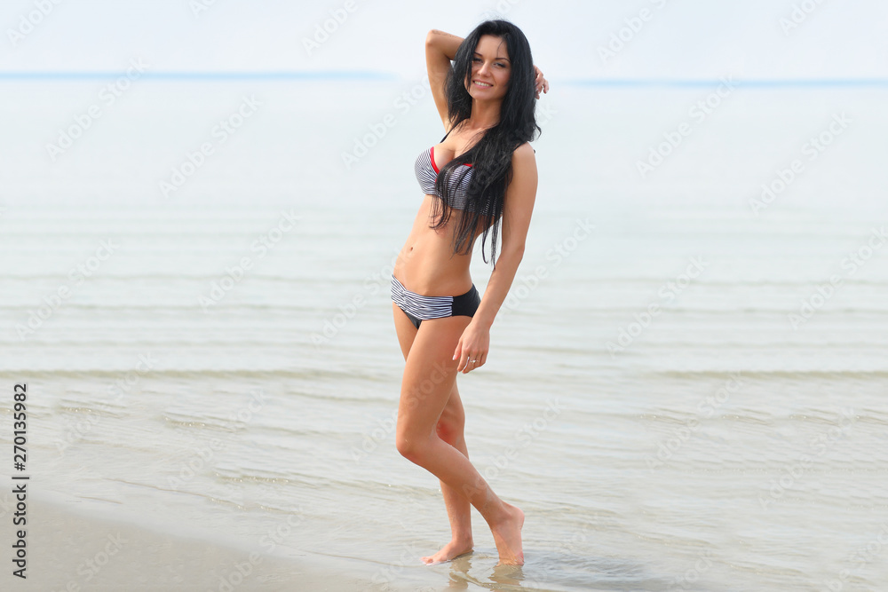 Beautiful girl in bikini on the beach