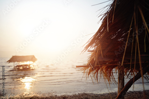 Bamboo hut,The place is made of bamboo and the backdrop is the sea, the sky, the sunshine. photo