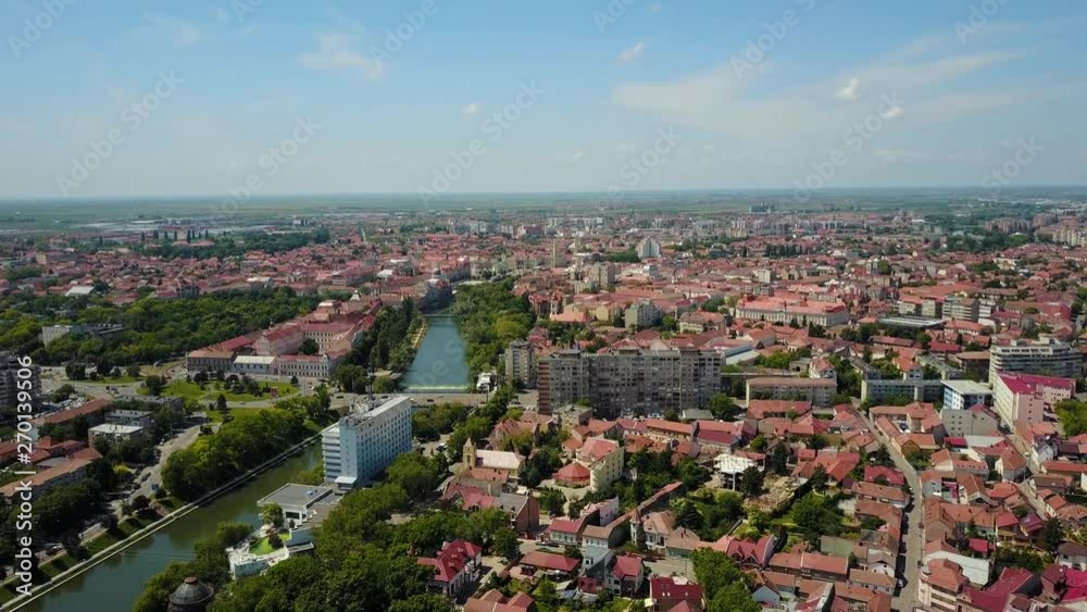 View of the city of Oradea from above, showcasing the the crisul repede river and the houses within the city. View of the city of Oradea from above, showcasing the the crisul repede river and the houses within the city.