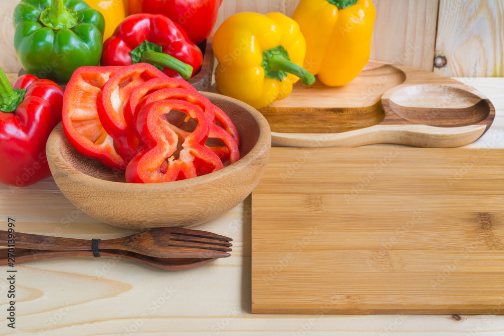 sweet peppers on wooden table background sweet peppers on wooden table background