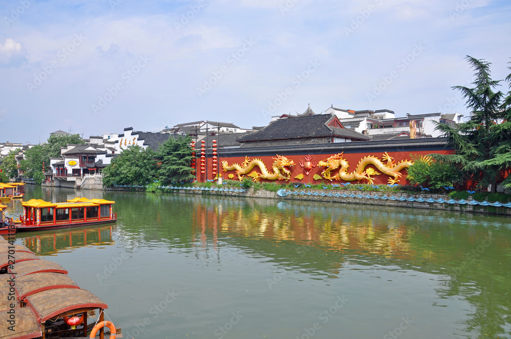 Dragon Wall on the bank of Qinhuai River in Confucius Temple, Nanjing, Jiangsu Province, China. Nanjing Confucius Temple (Fuzi Miao) go back to AD 1034. The temple was the seat of Confucian study for Dragon Wall on the bank of Qinhuai River in Confucius Temple, Nanjing, Jiangsu Province, China. Nanjing Confucius Temple (Fuzi Miao) go back to AD 1034. The temple was the seat of Confucian study for