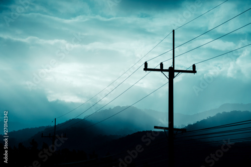  high voltage electric wire with cloudy sky.
