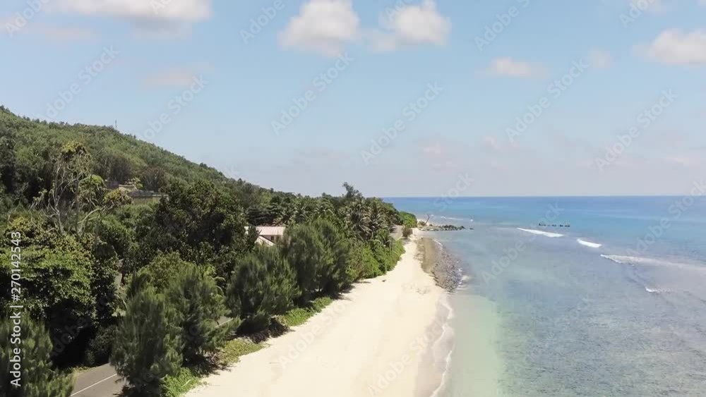 Gliding up to reveal the pristine sandy beach and crystal clear water. Segment 2 of 2 in Slow Motion Gliding up to reveal the pristine sandy beach and crystal clear water. Segment 2 of 2 in Slow Motion