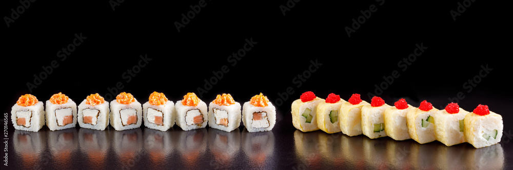 Classic sushi roll. Sushi at black background.Japanese seafood sushi , sushi a black background. Classic sushi roll. Sushi at black background.Japanese seafood sushi , sushi a black background.