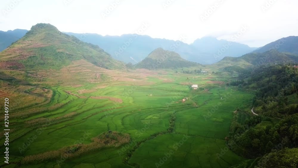 Aerial turning to houses sitting on the hills of rural Vietnam Aerial turning to houses sitting on the hills of rural Vietnam