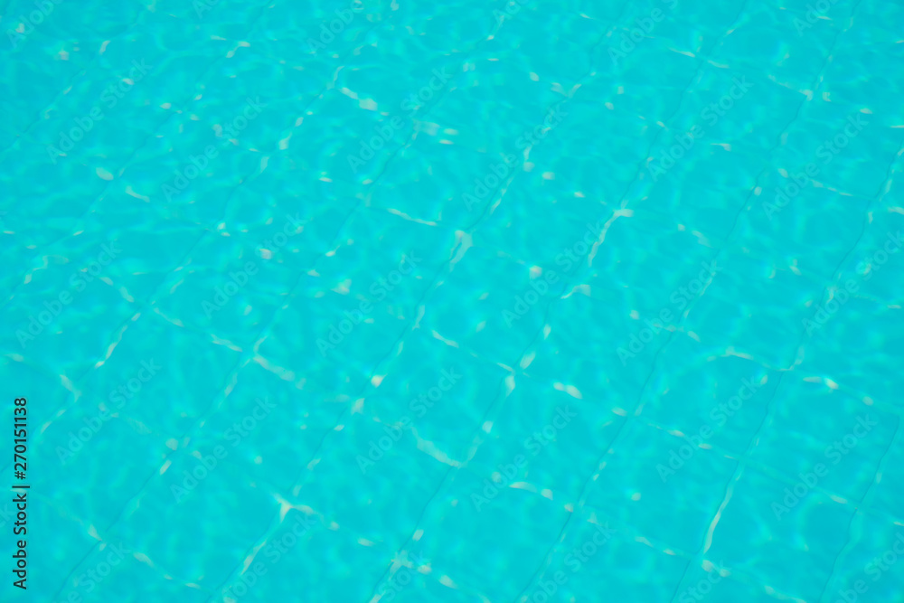 water rippled on swimming pool water surface for background