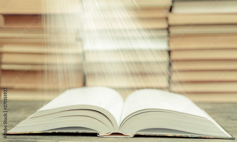 Book pages emit light. Symbol of wisdom, knowledge and learning. Book pages emit light. Symbol of wisdom, knowledge and learning.