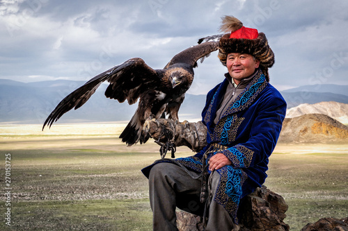 Mongolian Eagle Hunter with His Eagle, Bayan-Olgii, West Mongolia photo
