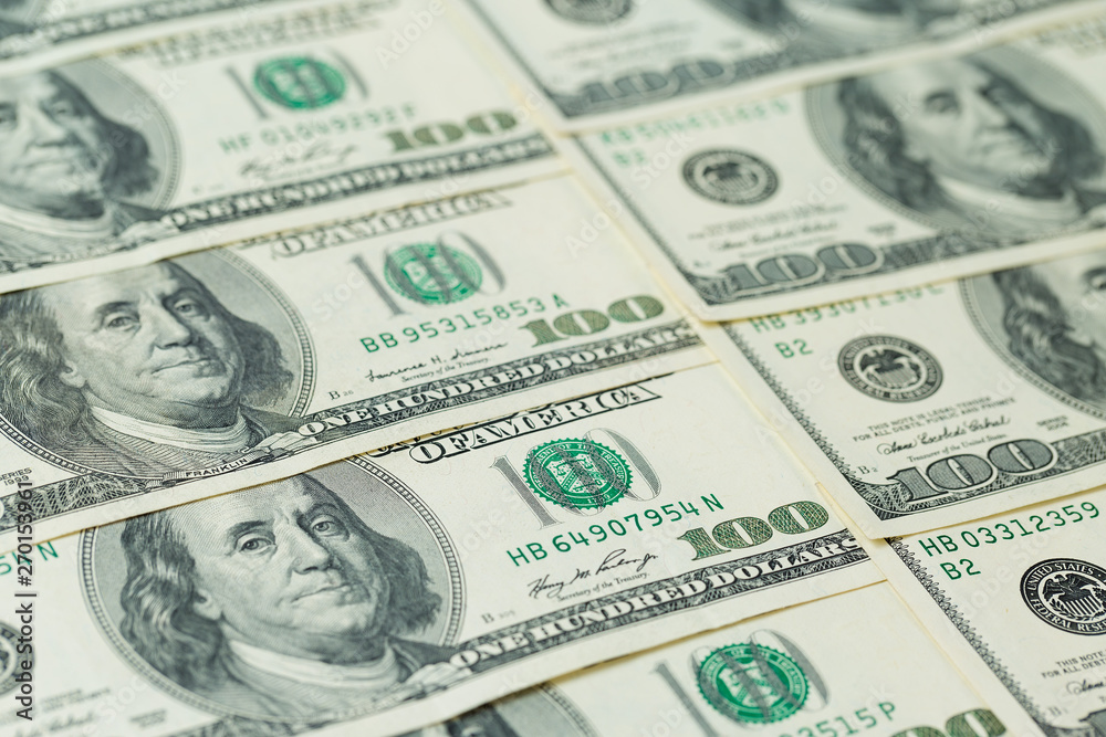 Background of one hundred dollar bills. Benjamin Franklin on USA money banknote Background of one hundred dollar bills. Benjamin Franklin on USA money banknote