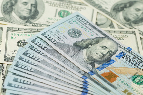 Background of one hundred dollar bills. Benjamin Franklin on USA money banknote 