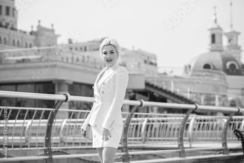 Luxurious woman in white suit at city. White dress code for lady. Fashionable business clothes  © T.Den_Team