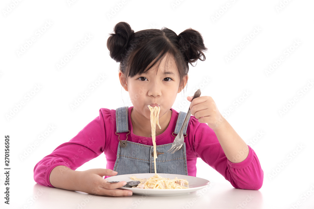 Cute asian girl eating Spaghetti Carbonara Cute asian girl eating Spaghetti Carbonara