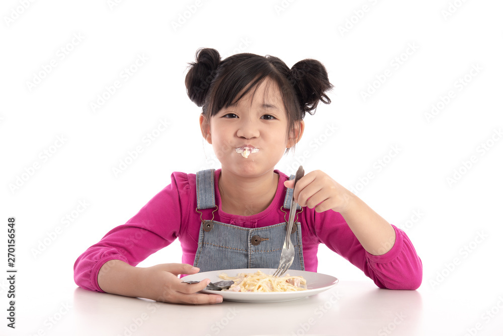 Cute asian girl eating Spaghetti Carbonara Cute asian girl eating Spaghetti Carbonara