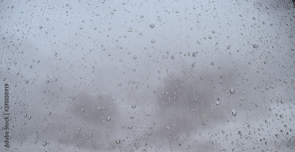 Raindrops on the window pane Atmospheric phenomenon expressed by high humidity and precipitation. Raindrops on the window pane Atmospheric phenomenon expressed by high humidity and precipitation.