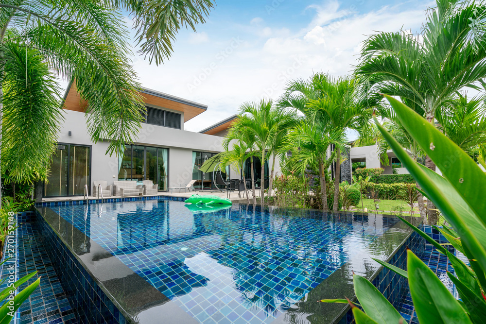 Fototapeta premium home or house building Exterior and interior design showing tropical pool villa with green garden
