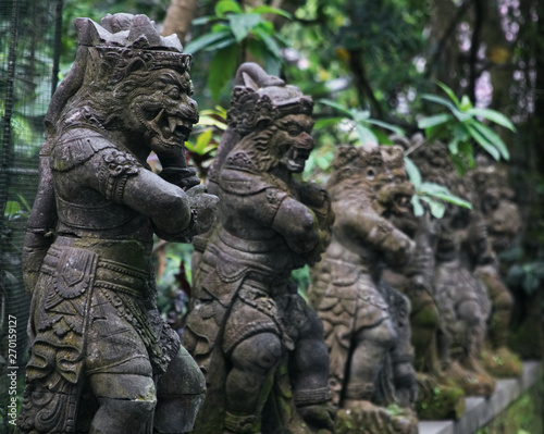 ancient looking statues in the monkey forest