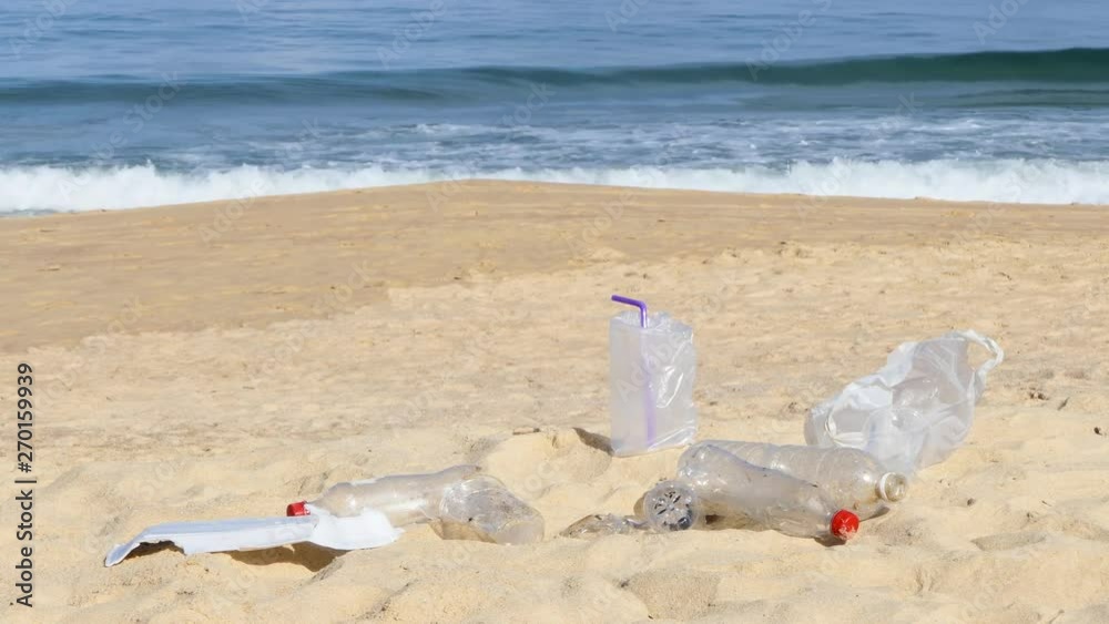 Garbage at the beach hurting the beautiful environment Garbage at the beach hurting the beautiful environment