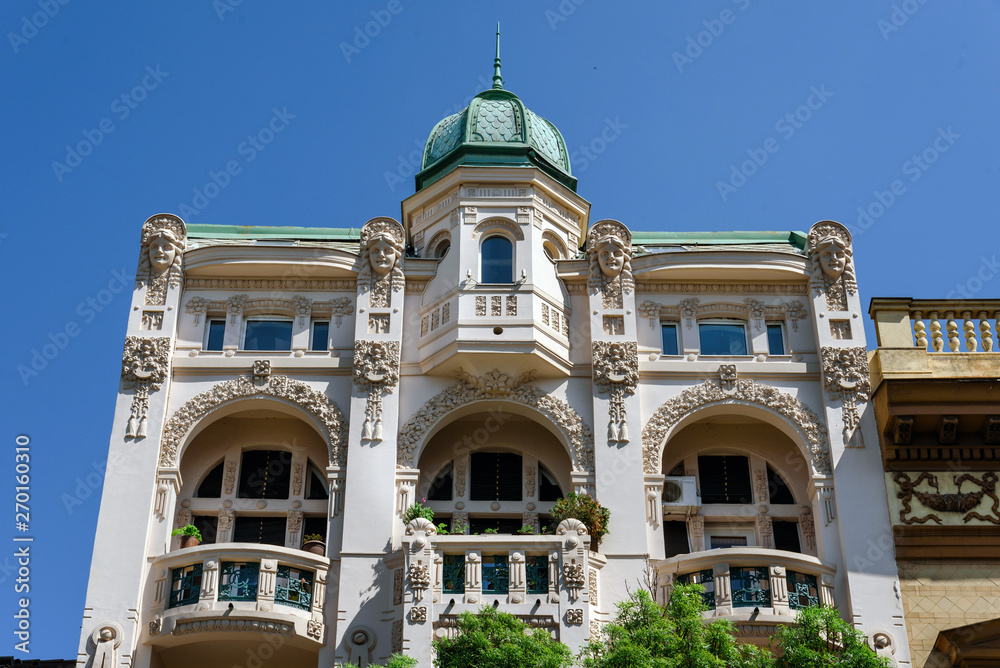 Belgrade, Serbia - April 19, 2018. Mansion in old town central street close view with details. Historical center with brownstone building facade and greenery.