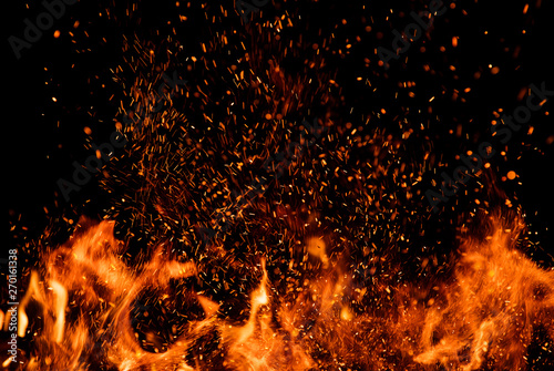 Fototapet Detail of fire sparks isolated on black background