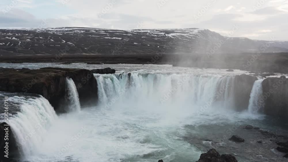 A panning and tilting shot from top right to buttom left. Showing the brutal force of the Godafoss waterfall located in Iceland. A panning and tilting shot from top right to buttom left. Showing the brutal force of the Godafoss waterfall located in Iceland.
