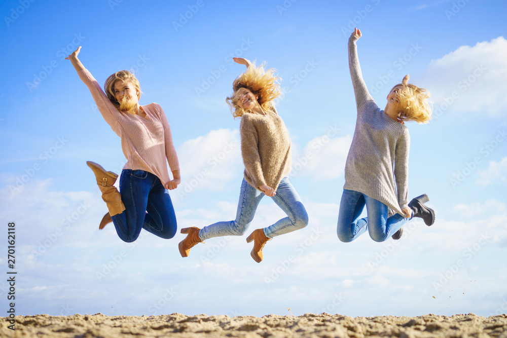 Three women jumping Three women jumping