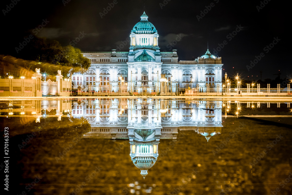 Dusit palace reflect in water at night in Bangkok Thailand