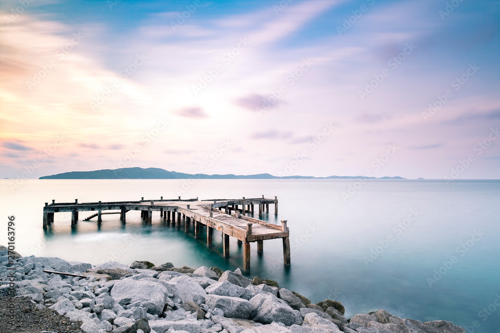 Fototapeta premium dock and pier at sea in twilight long exposure