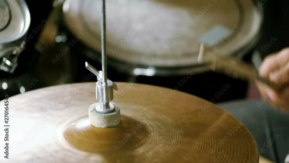 Musical band. Group of musicians playing rock music on stage. Close-up shot of drummer playing the drums by hitting it with sticks. Slow motion. HD Musical band. Group of musicians playing rock music on stage. Close-up shot of drummer playing the drums by hitting it with sticks. Slow motion. HD