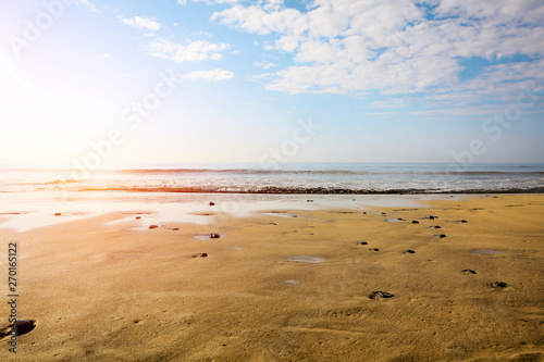 Summer background of ocean and beach with blue sky. Free space for your decoration. 