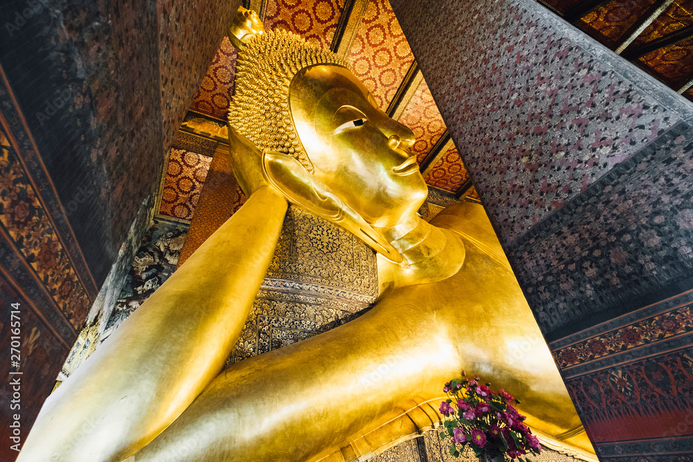 big sleep gold buddha statue at temple in Bangkok,Thailand