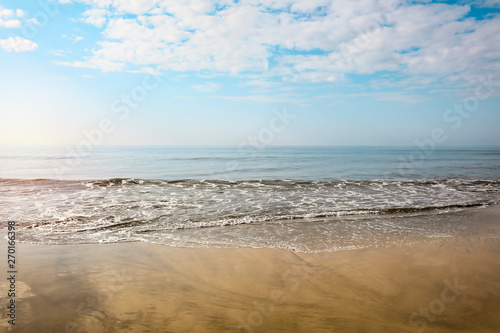 Summer background of ocean and beach with blue sky. Free space for your decoration. 