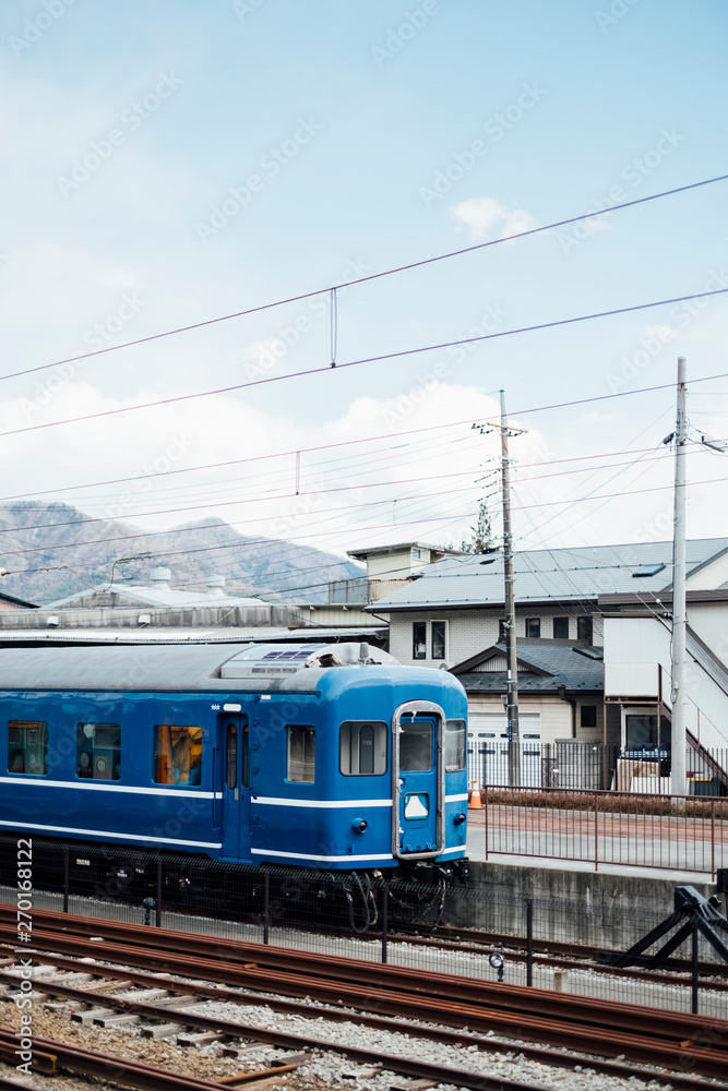 blue train and sky in railway of Japan