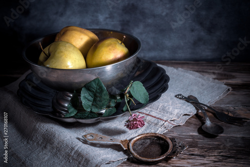 Vászonkép Still life with melchior bowl, apples and vintage cutlery