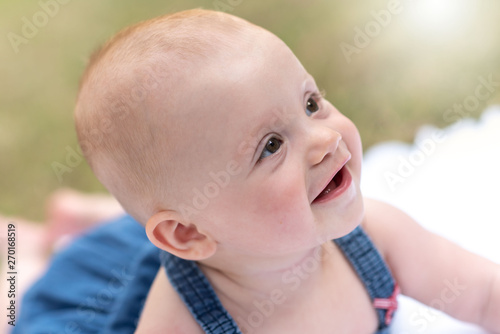 Portrait of cute baby girl  outdoors  light effect