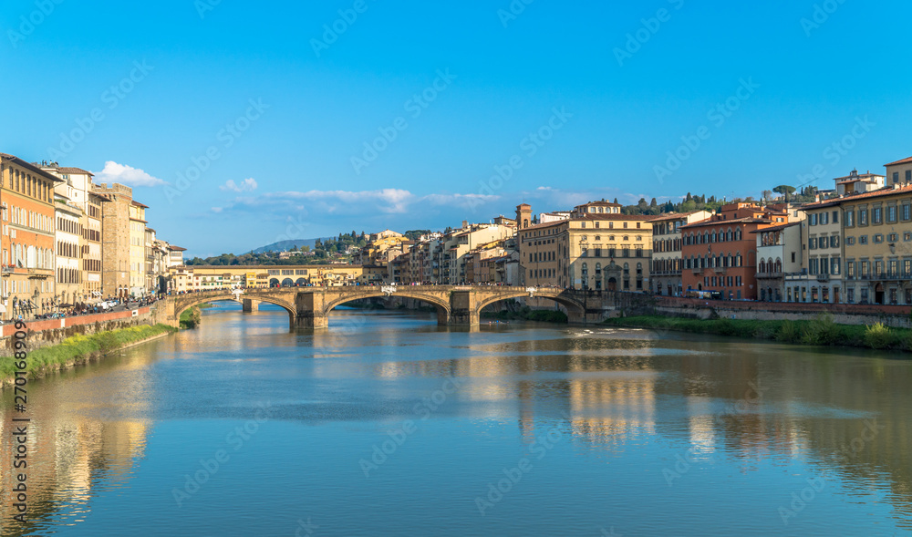 Florence, Tuscany / Italy: The Ponte Santa Trinita over the River Arno and the Ponte Vecchio in the distance