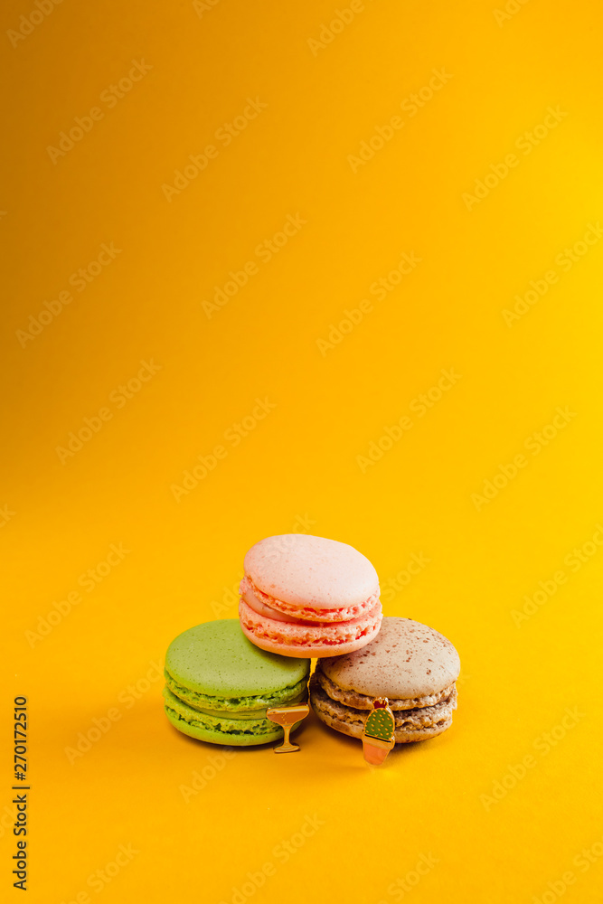 macaroon arranged in beautiful composition on a yellow background macaroon arranged in beautiful composition on a yellow background