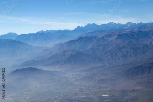 Misty blue Andean mountain landscape background