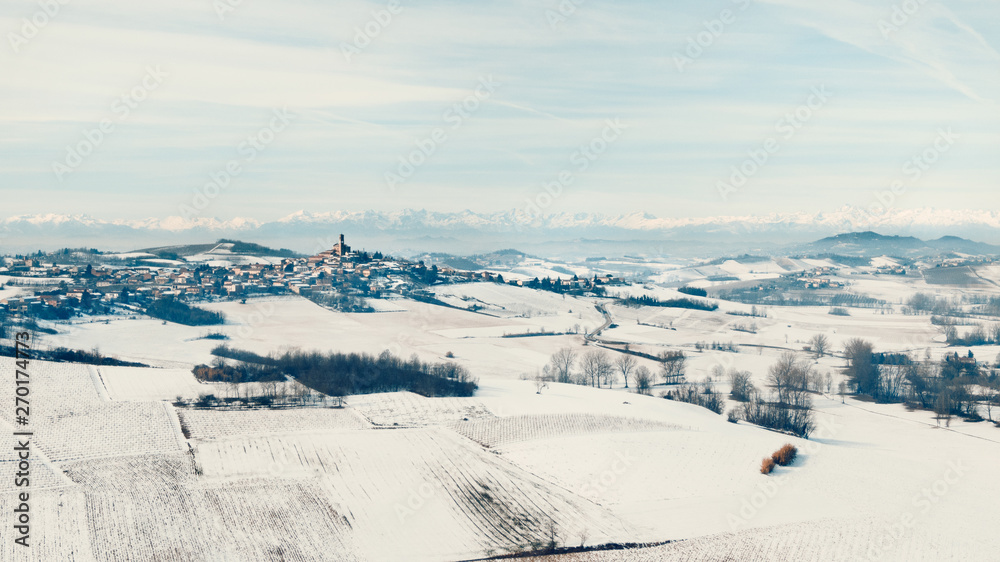 Aerial drone view of Monferrato hills covered with snow