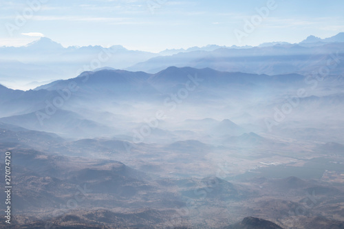 Misty blue Andean mountain landscape background © nomadkate