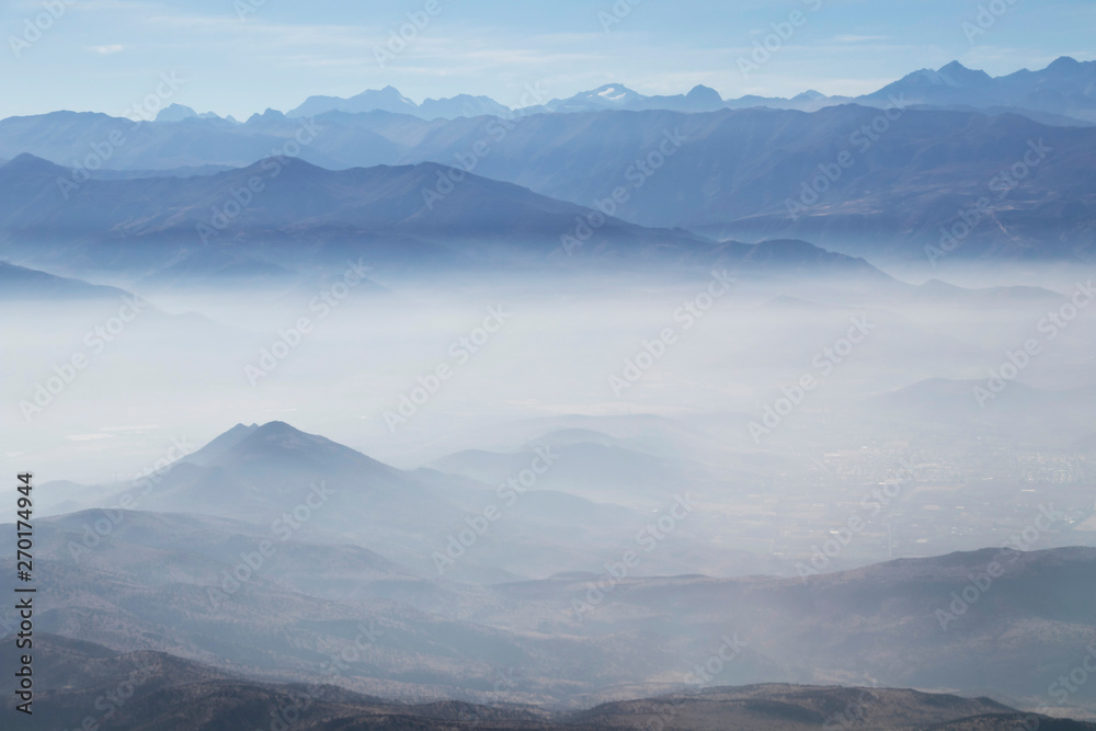 Misty blue Andean mountain landscape background Misty blue Andean mountain landscape background