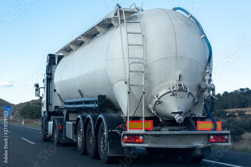 Freight truck traveling and transporting goods on the road to reach the destination