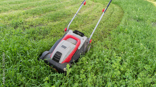 lawn mower on freshly cut grass