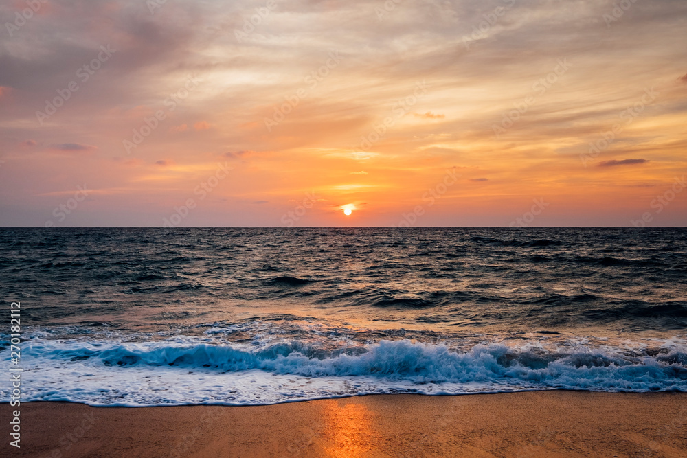 Fototapeta premium sunset beach and sea wave
