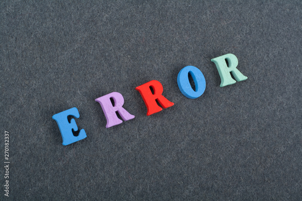 ERROR word on black board background composed from colorful abc alphabet block wooden letters, copy space for ad text. Learning english concept. ERROR word on black board background composed from colorful abc alphabet block wooden letters, copy space for ad text. Learning english concept.